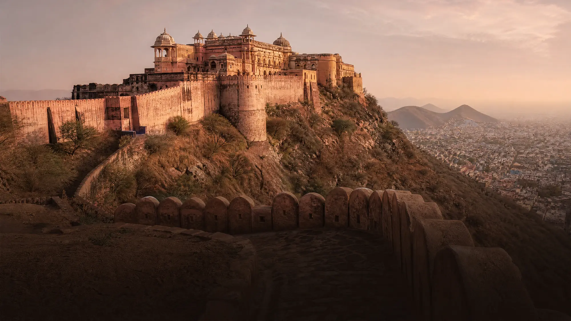 Nahargarh Fort sits 700 feet above Jaipur on the Aravalli ridge. It features an 18th-century royal retreat, historic water systems, and long defensive walls.